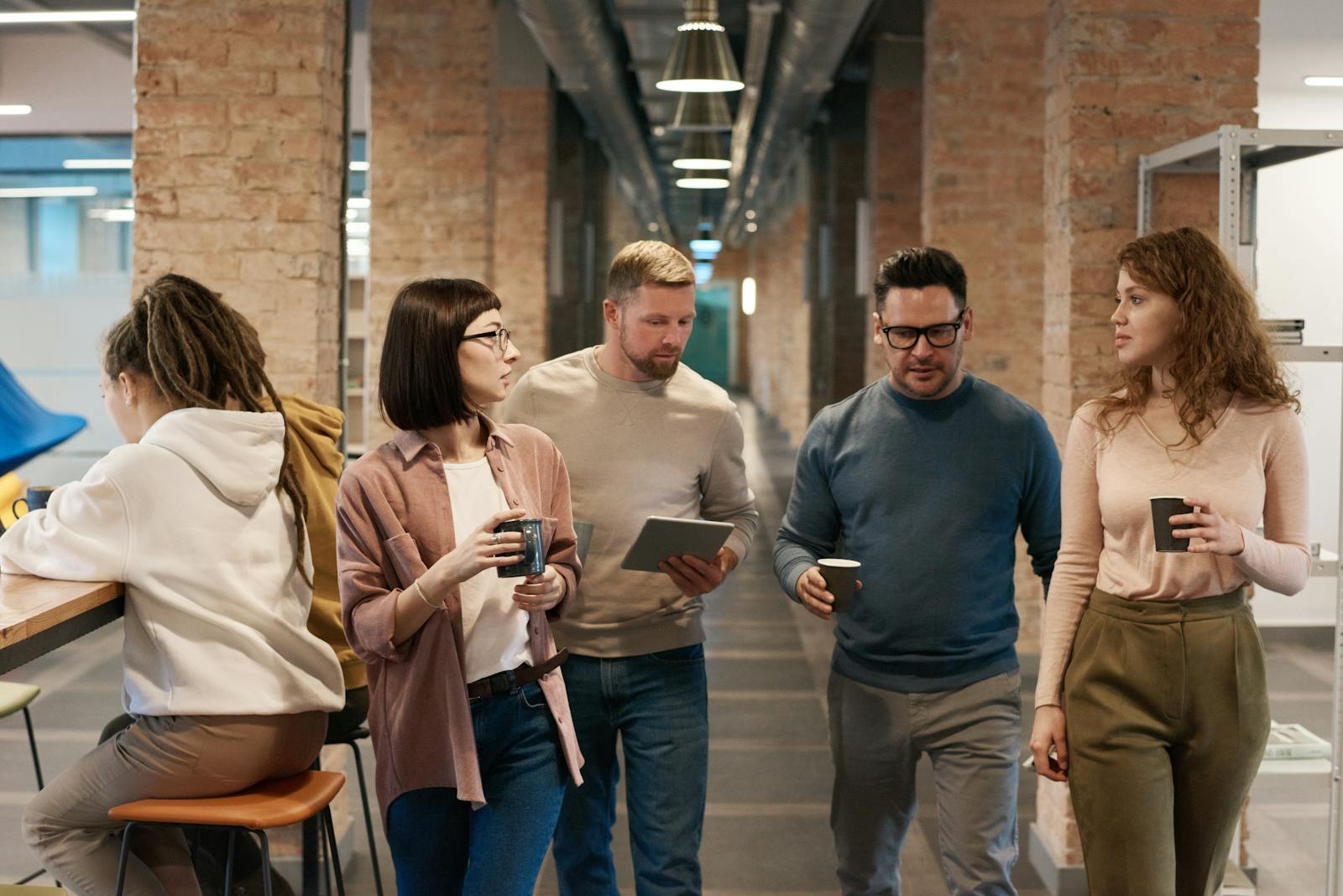 Photo Of People Walking On Hallway